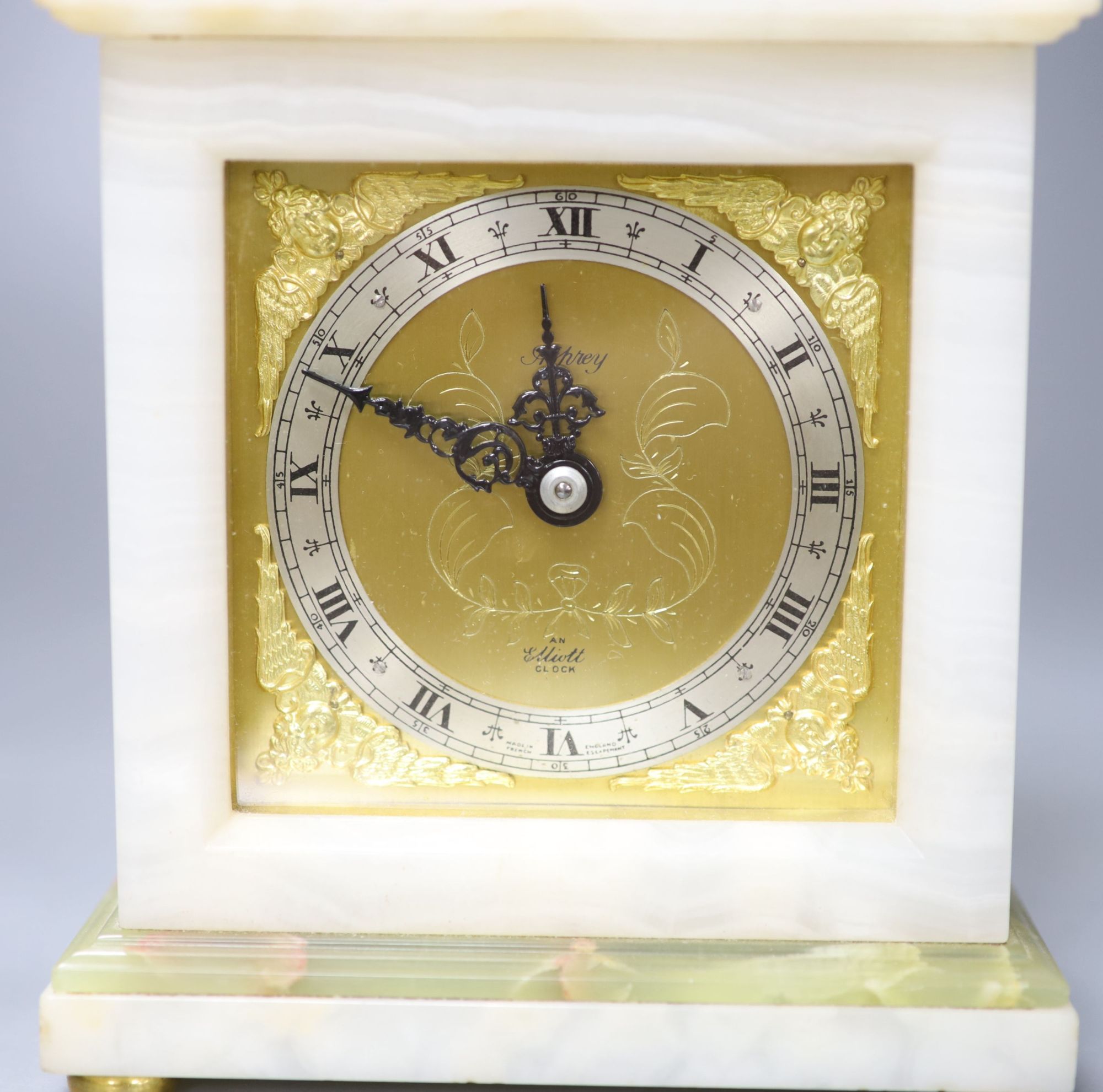 An Elliott onyx mantel clock, retailed by Asprey & Co., height 19cm